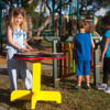 Playmore Designs TriPPPle Play Drum Table, children playing drums on a colorful outdoor playground