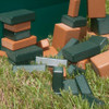 Playmore Designs Eco Building Blocks, image of colorful eco-friendly building blocks scattered on green grass.