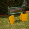 Playmore Designs Root View Planter, outdoor garden planter with a rectangular glass or plastic view window and green frame, accompanied by two yellow plant protection panels on grass.