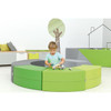 Moje Bambino Paolo Short Curved Foam Bench Seats, a circular, colorful foam seating arrangement with green and gray sections, designed for children to play and sit in a modern indoor play area.