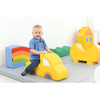 Moje Bambino Play Elements for Play Corner Mats, colorful foam play structures for children with a smiling toddler sitting on a yellow car-shaped piece.