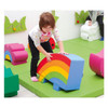 Moje Bambino Play Corner Mats, colorful foam puzzle mats designed for children's play area with a child playing on a rainbow-shaped foam block.
