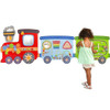 SPARK & WOW Train Montessori Wall Activity Boards, colorful interactive wall toy for children featuring various activities and a child playing.