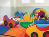 Children's Factory Rocking Airplane Soft Play Ride On Toy, colorful foam play equipment with a child crawling through a tunnel