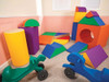 Angeles Tortoise & Hare Ride-On Scooter Pair, colorful foam play set with various shaped blocks and two ride-on scooters in green and blue for children