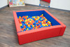 Children's Factory Corral Square Ball Pool Yard, colorful square ball pit with red and blue padded sides filled with yellow, orange, blue, and red plastic balls in a children's play area.