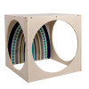 Angeles Tranquility Reading Cube - RTA, wooden sensory and reading cube with circular cutouts and colorful interior patterns.