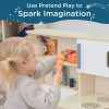 Angeles Combination Play Kitchen - RTA, girl playing with pretend vegetables in a mini kitchen set.