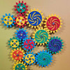 LiteZilla MagWiz Magnetic Wall Gears, colorful interlocking gear pieces arranged on a wall for wall decor and play.