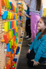 LiteZilla KidWorx™ Instant Reset Domino Dash Wall Activity, colorful domino pieces arranged on a pegboard for children's stacking and domino runs.