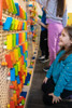 LiteZilla KidWorx™ Instant Reset Domino Dash Wall Activity, colorful domino pieces arranged on a pegboard for children's stacking and domino runs.