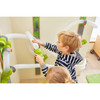 HABA Pro Wall Marble Run Set - Velcro Ball Track, children playing and assembling the toy on a wall with colorful tubes and tracks.