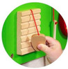 SPARK & WOW Percussion Wooden Mallet, hand holding a wooden mallet for crocodile and elephant wall toys.