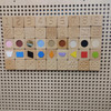 LiteZilla Kidworx Tactiles Sensory Wall Activity, a wooden wall panel featuring tactile and visual sensory blocks with numbers, shapes, textures, and colorful elements for sensory development and tactile exploration.