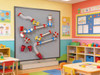 LiteZilla MagWiz Magnetic STEM Kinetics Wall Ball Run - 5x5, colorful interlocking tubes and balls arranged on a gray wall in a children's classroom.