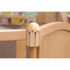 Jonti-Craft Hub Connector for KYDZ Suite® Classroom Dividers, close-up of the beige connector attaching two wooden dividers in a classroom setting.