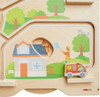 HABA Pro Children's Emergency Vehicles Wall Activity, children playing with fire rescue toy and house on a wooden activity wall.
