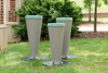 Freenotes Bossa Nova Outdoor Drums, three grey outdoor drums placed on grass in a park setting.