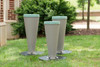 Freenotes Bossa Nova Outdoor Drums, three grey outdoor drums placed on grass in a park setting. Freenotes Bossa Nova Outdoor Drums, three grey outdoor drums placed on grass in a park setting.