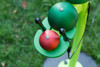 Freenotes Caterpillar Bells, vibrant green and red bells mounted on a green stand, designed for outdoor musical play and entertainment.