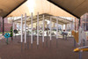 Freenotes Contrabass Outdoor Chimes, large metallic chimes array under a shelter in an outdoor park setting