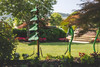 Freenotes Tenor Tree Outdoor Bells, colorful wind chimes hanging in a garden.
