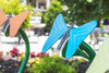 Freenotes Butterfly Musical Bells, colorful butterfly-shaped musical wind chimes on a green garden stake. Freenotes Butterfly Musical Bells, colorful butterfly-shaped musical wind chimes on a green garden stake.