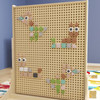 Flash Furniture Bright Beginnings Pastel Shape Set for Modular STEAM Wall Systems, 256 Pack, showing a pegboard with colorful pastel animal shapes for educational and creative play.