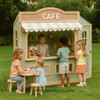 Kid's Wood Store Café Wooden Playhouse - Indoor or Outdoor, children playing inside and outside the pretend café with kids serving and kids ordering drinks.