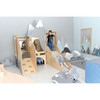 Moje Bambino Summit Toddler Play Loft, children playing on a wooden indoor play structure with mountain-themed decorations in the background.