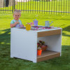 Whitney Brothers outdoorED™ Sensory Table, children playing with gardening tools, flowers, and water toys outdoors on a sunny day.