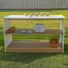 Whitney Brothers outdoorED™ Storage Shelf, outdoor wooden storage shelf with three tiers displaying gardening and outdoor toys on a grassy lawn with a fence in the background.