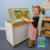 Whitney Brothers elevatED™ Mobile Big Book Display, child interacting with large illustrated book in a classroom setting.