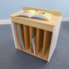 Whitney Brothers elevatED™ Mobile Big Book Display, portable storage cart with open compartments holding books, topped with an open children's picture book.