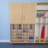 Whitney Brothers elevatED™ Classroom Organizer, a wooden multi-tiered storage unit with labeled cubbies, shelves, and compartments for organizing classroom supplies and student belongings.