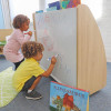 Whitney Brothers elevatED™ Mobile Book Display, children drawing on whiteboard with books on top