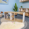 Whitney Brothers elevatED™ Discovery Crawl Thru Cabinet, children's educational furniture with open shelves and cubbies, in a playroom setting with toys and plush animals.