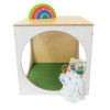Whitney Brothers elevatED™ Play House Cube With Floor Mat Set, wooden playhouse with rainbow stacking toy on top, green floor mat inside, and a book and blanket outside.