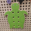 LiteZilla Kidworx™ Animal Assembly Adventure Wall Activity, colorful turtle-shaped wooden puzzle with multiple holes for puzzle pieces.