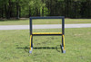 Infinity Playgrounds Portable Outdoor Art Panel, a metal outdoor art panel with yellow accents set on a grassy field with a forest background.