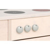 Moje Bambino Bianca Kitchen Cabinet with Stove and Sink, wooden cabinet with three round white knobs and a white stove top with black and red burners.