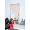 Moje Bambino Summit Wall Mirror Decor, children's bedroom wall mirror with mountain and deer design, wooden frame, and playful mountain landscape artwork for kids' room decor.