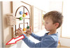 HABA Pro Wall Guide Rail Stop Brackets for Sensory Wall Toys, set of 4, installed on a sensory wall with a young child interacting with the wall-mounted toys.