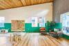 LiteZilla Kidworx™ Giant Pegboard Wall Panel, colorful pegboard in a children's playroom.