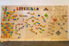 LiteZilla Kidworx™ Giant Pegboard Wall Panel, colorful educational and play wall with various pegs, gears, and maze structures for kids' creativity and motor skills development.