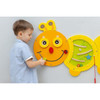 Moje Bambino Caterpillar Sensory Activity Panel, interactive children's sensory play panel with a smiling caterpillar face and movable elements for motor skill development.