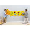 Moje Bambino Caterpillar Sensory Activity Panel, children playing with a colorful educational sensory activity wall.
