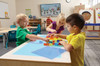 Jonti-Craft Large Light Table - Multicolored, children playing with colorful building blocks on a light table in a classroom.