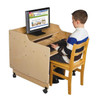 Wood Designs Mobile Computer Desk, Assembled, featuring a spacious wooden surface, mobile caster wheels for easy movement, and a side panel for stability, with a young boy using a desktop computer while seated on a wooden chair.
