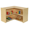 Wood Designs Contender Small Corner Storage Unit, RTA, a light-colored wooden corner storage unit with multiple shelves holding colorful educational toys and games.
